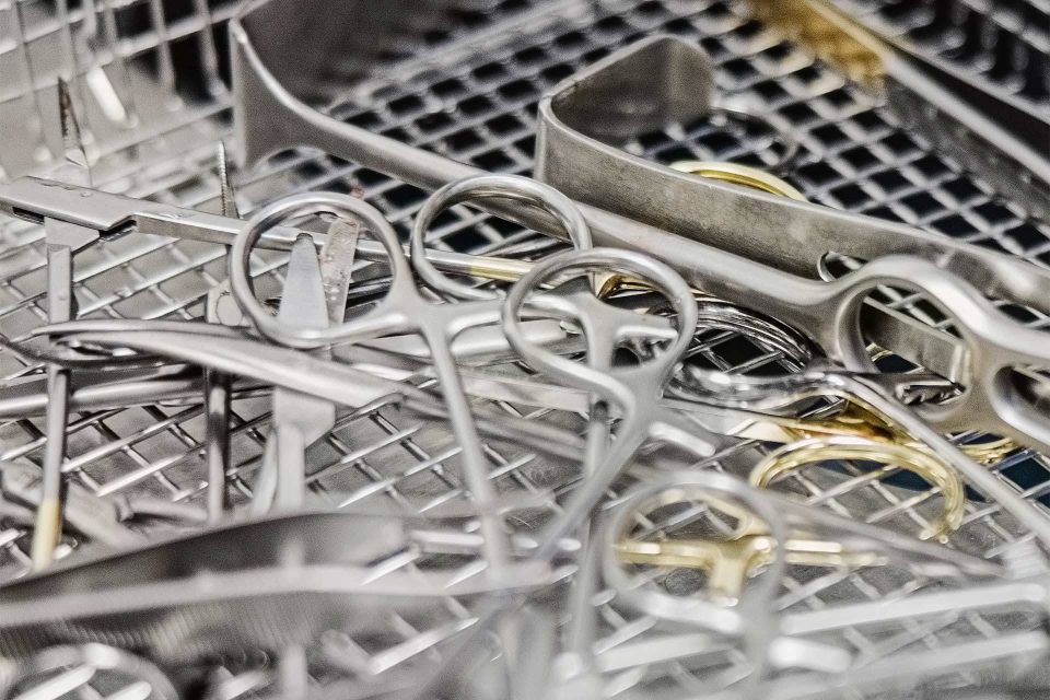 Tray of metal BoneSim instruments as part of BoneSim instrument testing and validation session.