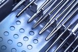 Metal instruments in trays and cases.