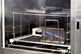 Metal trays full of instruments undergoing reusable life cycle testing by BoneSim.